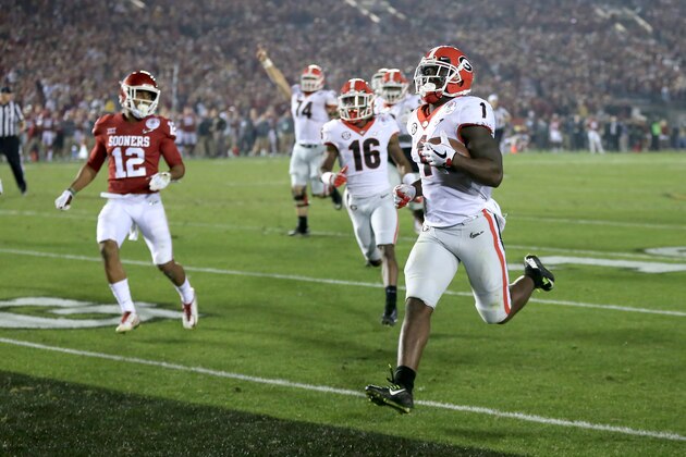 PASADENA, CA - JANUARY 01:  Sony Michel #1 of the Georgia Bulldogs scores the winning touchdown in the 2018 College Football Playoff Semifinal Game against the Oklahoma Sooners at the Rose Bowl Game presented by Northwestern Mutual at the Rose Bowl on January 1, 2018 in Pasadena, California.  (Photo by Sean M. Haffey/Getty Images)