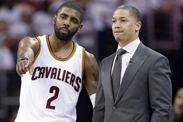 FILE  - In this April 20, 2016, file photo, Cleveland Cavaliers' Kyrie Irving, left, talks with head coach Tyronn Lue durng the second half of an NBA basketball playoff game against the Detroit Pistons in Cleveland. With Washington and Boston headed to a Game 7 on Monday, Cleveland's break since sweeping Toronto in the second round just grew a little longer. (AP Photo/Tony Dejak, File)