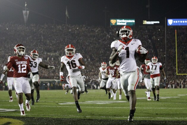 Georgia running back Sony Michel (1) scores a touchdown in overtime against Oklahoma in the Rose Bowl NCAA college football game, Monday, Jan. 1, 2018, in Pasadena, Calif. Georgia won 54-48. (AP Photo/Jae C. Hong)