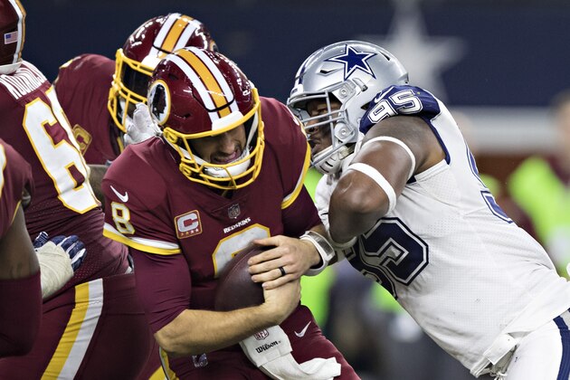 ARLINGTON, TX - NOVEMBER 30:  David Irving #95 of the Dallas Cowboys sacks Kirk Cousins #8 of the Washington Redskins at AT&T Stadium on November 30, 2017 in Arlington, Texas.  The Cowboys defeated the Redskins 38-14.  (Photo by Wesley Hitt/Getty Images)