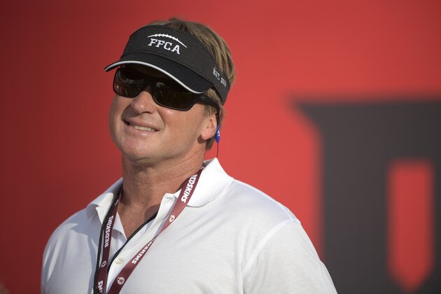 ESPN broadcaster, and former head coach Jon Gruden watches warmups before an NFL preseason football game between the Tampa Bay Buccaneers and the Washington Redskins Thursday, Aug. 31, 2017, in Tampa, Fla. (AP Photo/Phelan M. Ebenhack)