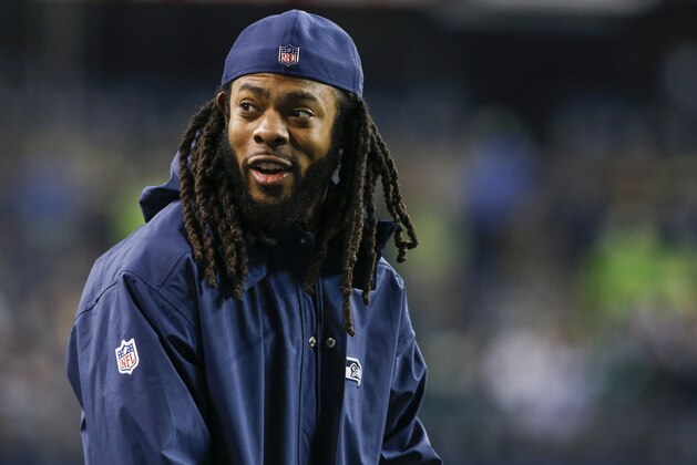 SEATTLE, WA - DECEMBER 03: Injured cornerback Richard Sherman of the Seattle Seahawks smiles from the sidelines before the game against the Philadelphia Eagles at CenturyLink Field on December 3, 2017 in Seattle, Washington. (Photo by Otto Greule Jr /Getty Images)