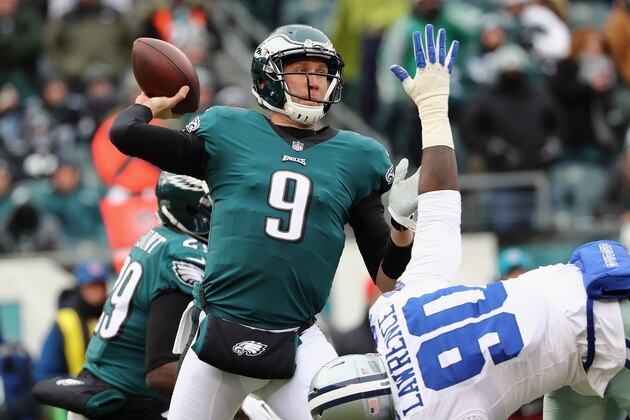 PHILADELPHIA, PA - DECEMBER 31:  Quarterback Nick Foles #9 of the Philadelphia Eagles looks ot pass against defensive end Demarcus Lawrence #90 of the Dallas Cowboys during the first quarter of the game at Lincoln Financial Field on December 31, 2017 in Philadelphia, Pennsylvania.  (Photo by Elsa/Getty Images)