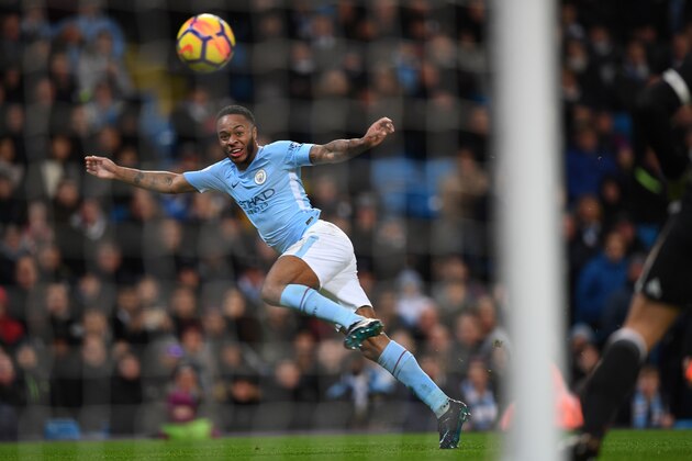 Manchester City's English midfielder Raheem Sterling heads wide during the English Premier League football match between Manchester City and Watford at the Etihad Stadium in Manchester, north west England, on January 2, 2018. / AFP PHOTO / Paul ELLIS / RESTRICTED TO EDITORIAL USE. No use with unauthorized audio, video, data, fixture lists, club/league logos or 'live' services. Online in-match use limited to 75 images, no video emulation. No use in betting, games or single club/league/player publications.  /         (Photo credit should read PAUL ELLIS/AFP/Getty Images)