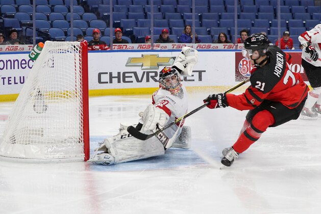 BUFFALO, NY - JANUARY 02: Brett Howden #21 of Canada scores past Philip Wüthrich #30 of Switzerland for team Canada's first goal during the first period of play in the Quarterfinal IIHF World Junior Championship game at the QeyBank Center on January 2, 2018 in Buffalo, New York. (Photo by Nicholas T. LoVerde/Getty Images)