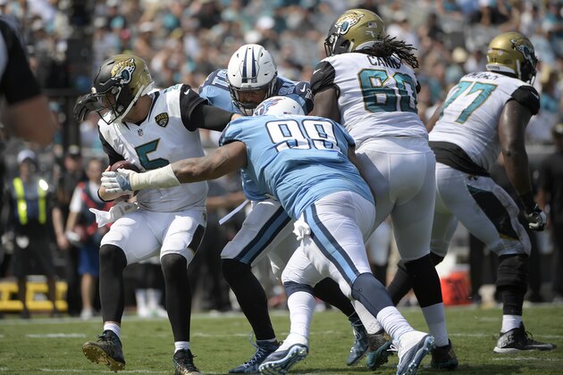 FILE - In this Sept. 17, 2017, file photo, Tennessee Titans defensive end Jurrell Casey (99) and outside linebacker Derrick Morgan (91) combine to sack Jacksonville Jaguars quarterback Blake Bortles (5) during the second half an NFL football game, in Jacksonville, Fla. It’s been nearly 10 months since the Jacksonville Jaguars won at EverBank Field. It’s been a year since they enjoyed consecutive victories. “We’ve gone up-down, up-down, so that’s kind of been what everybody’s talked about, the inconsistency or lack of consistency,” Jaguars quarterback Blake Bortles said. “So we have to find a way to win two in a row and get it rolling from there.”(AP Photo/Phelan M. Ebenhack)