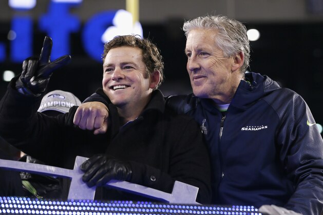 EAST RUTHERFORD, NJ - FEBRUARY 02: (L-R) John Schneider, General Manager of the Seattle Seahawks and head coach Pete Carroll celebrates after their 43-8 victory over the Denver Broncos during Super Bowl XLVIII at MetLife Stadium on February 2, 2014 in East Rutherford, New Jersey.  (Photo by Kevin C. Cox/Getty Images)