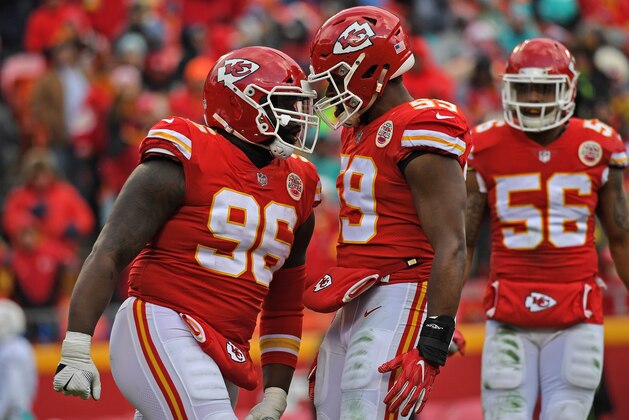 KANSAS CITY, MO - DECEMBER 24:  Nose tackle Bennie Logan #96 of the Kansas City Chiefs celebrates with teammate inside linebacker Reggie Ragland #59, after a tackle for a loss against the Miami Dolphins during the second half of the game at Arrowhead Stadium on December 24, 2017 in Kansas City, Missouri. ( Photo by Peter G. Aiken/Getty Images )