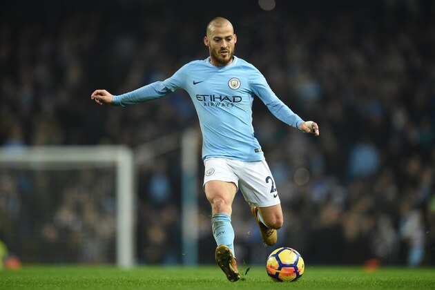 Manchester City's Spanish midfielder David Silva runs with the ball during the English Premier League football match between Manchester City and Bournemouth at the Etihad Stadium in Manchester, north west England, on December 23, 2017. / AFP PHOTO / Oli SCARFF / RESTRICTED TO EDITORIAL USE. No use with unauthorized audio, video, data, fixture lists, club/league logos or 'live' services. Online in-match use limited to 75 images, no video emulation. No use in betting, games or single club/league/player publications.  /         (Photo credit should read OLI SCARFF/AFP/Getty Images)