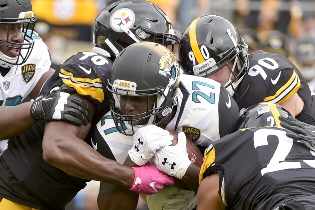 Pittsburgh Steelers defensive end L.T. Walton (96), outside linebacker T.J. Watt (90) and free safety Mike Mitchell (23) stop Jacksonville Jaguars running back Leonard Fournette (27) during an NFL football game, Sunday, Oct. 8, 2017, in Pittsburgh. (AP Photo/Fred Vuich)