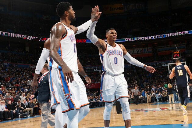 OKLAHOMA CITY, OK - DECEMBER 18: Paul George #13 and Russell Westbrook #0 of the Oklahoma City Thunder react during the game against the Denver Nuggets on December 18, 2017 at Chesapeake Energy Arena in Oklahoma City, Oklahoma. NOTE TO USER: User expressly acknowledges and agrees that, by downloading and or using this photograph, User is consenting to the terms and conditions of the Getty Images License Agreement. Mandatory Copyright Notice: Copyright 2017 NBAE (Photo by Layne Murdoch/NBAE via Getty Images)