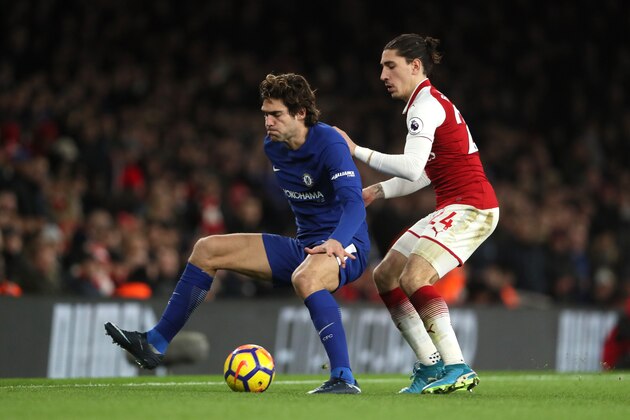 LONDON, ENGLAND - JANUARY 03:  Marcos Alonso of Chelsea competes with Hector Bellerin of Arsenal during the Premier League match between Arsenal and Chelsea at Emirates Stadium on January 3, 2018 in London, England.  (Photo by Matthew Ashton - AMA/Getty Images)