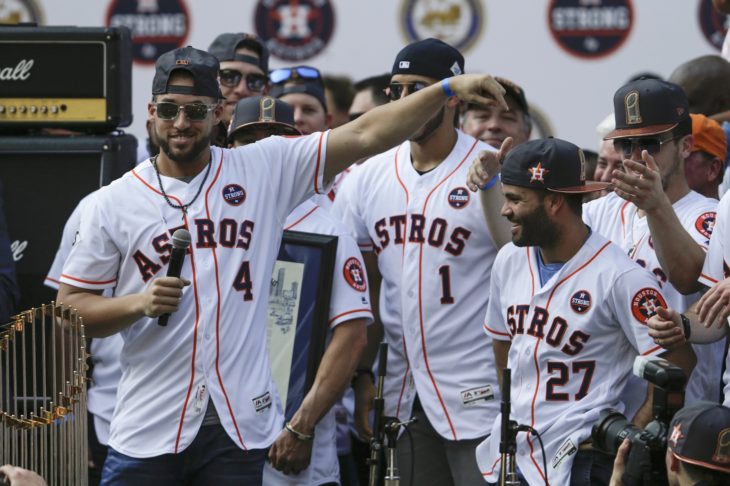 HOUSTON, TX - NOVEMBER 03:  George Springer #4 of the Houston Astros points toward Jose Altuve #27 during the Houston Astros Victory Parade on November 3, 2017 in Houston, Texas.  The Astros defeated the Los Angeles Dodgers 5-1 in Game 7 to win the 2017 World Series.  (Photo by Tim Warner/Getty Images)