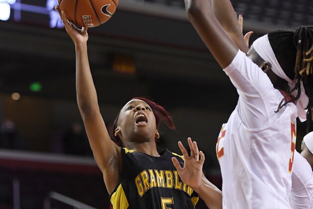 Grambling State guard Shakyla Hill, left, shoots as Southern California forward Ja'Tavia Tapley defends during the first half of an NCAA college basketball game, Friday, Dec. 16, 2016, in Los Angeles. (AP Photo/Mark J. Terrill)