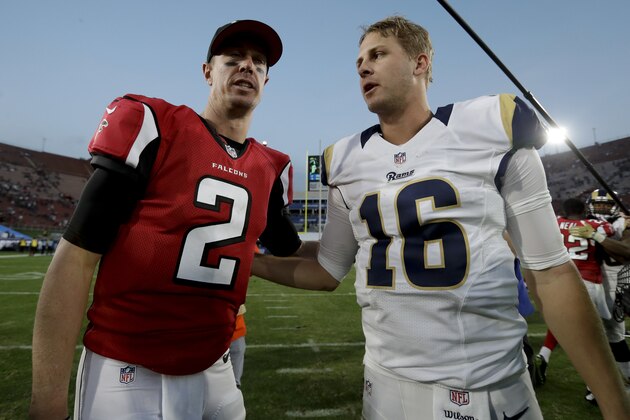 Atlanta Falcons quarterback Matt Ryan, left, and Los Angeles Rams quarterback Jared Goff meet on the field after an NFL football game Sunday, Dec. 11, 2016, in Los Angeles. (AP Photo/Rick Scuteri)