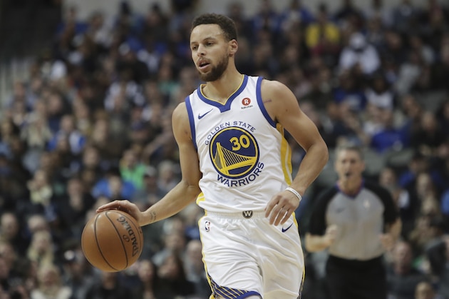 Golden State Warriors guard Stephen Curry dribbles during the first half of an NBA basketball game against the Dallas Mavericks in Dallas, Wednesday, Jan. 3, 2018. (AP Photo/LM Otero)
