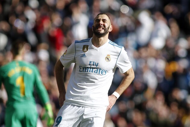 Real Madrid's French forward Karim Benzema reacts during the Spanish League 'Clasico' football match Real Madrid CF vs FC Barcelona at the Santiago Bernabeu stadium in Madrid on December 23, 2017.  / AFP PHOTO / OSCAR DEL POZO        (Photo credit should read OSCAR DEL POZO/AFP/Getty Images)