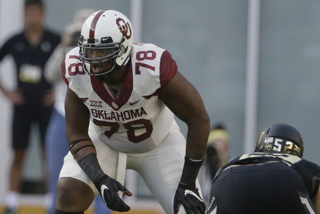 FILE - In this Sept. 23, 2017, file photo, Oklahoma offensive lineman Orlando Brown (78) lines up during the first half of an NCAA college football game against Baylor, in Waco, Texas. Brown is massive (6-foot-8, 345 pounds), athletic and a potential high first-round draft pick. He protects Baker Mayfield’s blindside. (AP Photo/LM Otero, File)