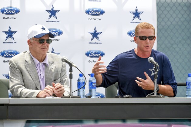 Dallas Cowboys head coach Jason Garrett, right, answers a question from the media as Cowboys owner Jerry Jones looks on during the