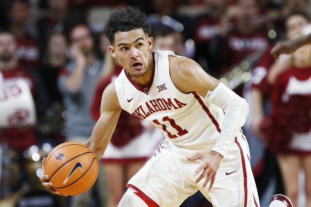 Oklahoma guard Trae Young heads up court in the second half of an NCAA college basketball game against Oklahoma State in Norman, Okla., Wednesday, Jan. 3, 2018. Oklahoma won 109-89. (AP Photo/Sue Ogrocki)