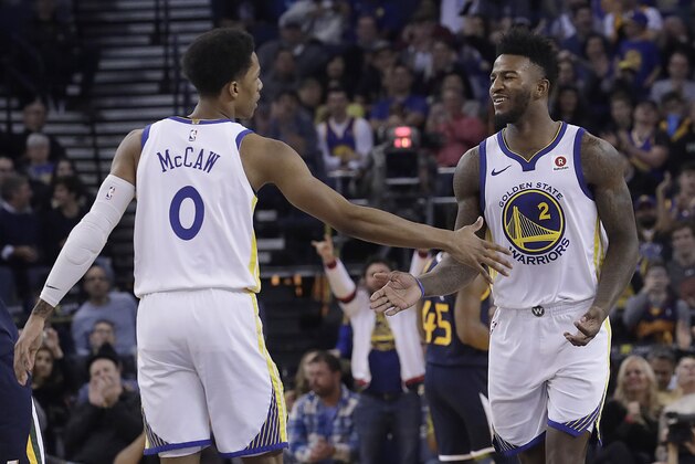Golden State Warriors guard Patrick McCaw (0) and forward Jordan Bell (2) celebrate during the second half of an NBA basketball game against the Utah Jazz in Oakland, Calif., Wednesday, Dec. 27, 2017. (AP Photo/Jeff Chiu)