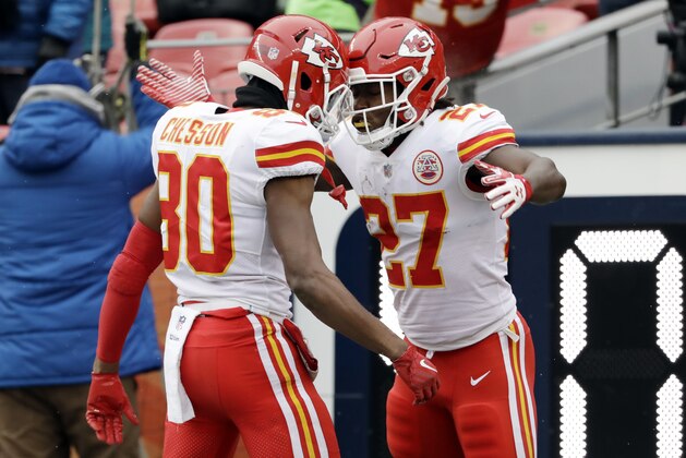 Kansas City Chiefs running back Kareem Hunt (27) celebrates his rushing touchdown with teammate Jehu Chesson (80) during the first half of an NFL football game against the Denver Broncos, Sunday, Dec. 31, 2017, in Denver. (AP Photo/Joe Mahoney )