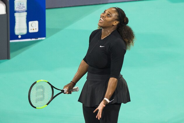 Serena Williams of the US reacts after losing a point to Jelena Ostapenko of Latvia during the Mubadala World Tennis Championship 2017 match in Abu Dhabi, on December 30, 2017.  / AFP PHOTO / NEZAR BALOUT        (Photo credit should read NEZAR BALOUT/AFP/Getty Images)