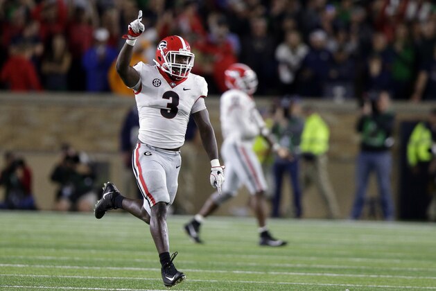 Georgia linebacker Roquan Smith (3) celebrates after a Georgia fumble recovery late in the second half of an NCAA college football game against Notre Dame in South Bend, Ind., Saturday, Sept. 9, 2017. Georgia won 20-19. (AP Photo/Michael Conroy)