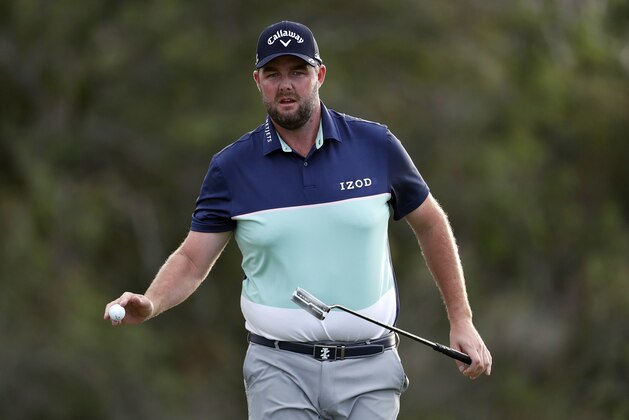 Marc Leishman waves to the crowd on the 18th green during the first round of the Tournament of Champions golf event, Thursday, Jan. 4, 2018, at Kapalua Plantation Course in Kapalua, Hawaii. (AP Photo/Matt York)