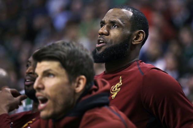 Cleveland Cavaliers forward LeBron James watches the fourth quarter from the bench during the team's NBA basketball game against the Boston Celtics in Boston, Wednesday, Jan. 3, 2018. The Celtics won 102-88. (AP Photo/Charles Krupa)