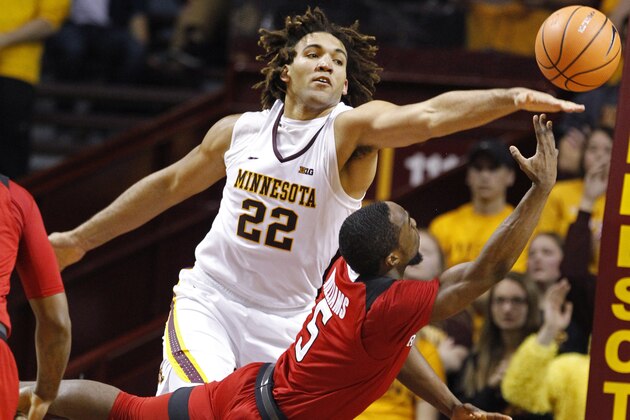 Minnesota center Reggie Lynch (22) tries to block a shot by Rutgers guard Mike Williams (5) during the second half of an NCAA college basketball game Sunday, Dec. 3, 2017, in Minneapolis. Minnesota won 89-67. (AP Photo/Bruce Kluckhohn) Minnesota center Reggie Lynch (22) tries to block a shot by Rutgers guard Mike Williams (5) during the second half of an NCAA college basketball game Sunday, Dec. 3, 2017, in Minneapolis. Minnesota won 89-67. (AP Photo/Bruce Kluckhohn)