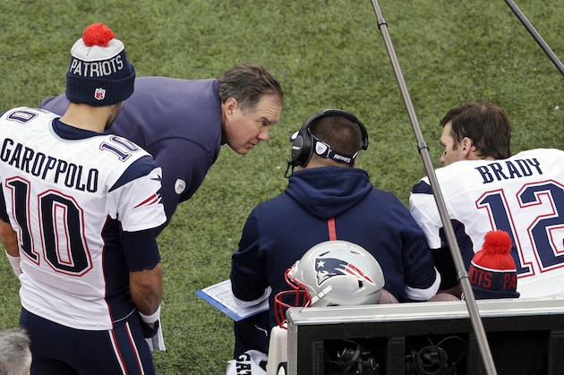 New England Patriots head coach Bill Belichick, second from left, talks to Tom Brady (12) and Jimmy Garoppolo (10) during the second half of an NFL football game against the New York Jets, Sunday, Dec. 27, 2015, in East Rutherford, N.J. (AP Photo/Peter Morgan)