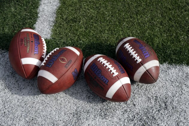 Footballs used by the Northwestern team are seen on the filed before an NCAA college football game against Nebraska in Lincoln, Neb., Saturday, Nov. 4, 2017. (AP Photo/Nati Harnik)