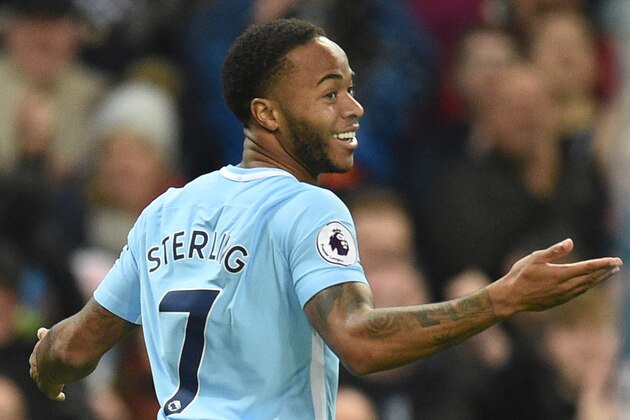 Manchester City's English midfielder Raheem Sterling celebrates scoring their second goal during the English Premier League football match between Manchester City and Bournemouth at the Etihad Stadium in Manchester, north west England, on December 23, 2017. / AFP PHOTO / Oli SCARFF / RESTRICTED TO EDITORIAL USE. No use with unauthorized audio, video, data, fixture lists, club/league logos or 'live' services. Online in-match use limited to 75 images, no video emulation. No use in betting, games or single club/league/player publications.  /         (Photo credit should read OLI SCARFF/AFP/Getty Images)