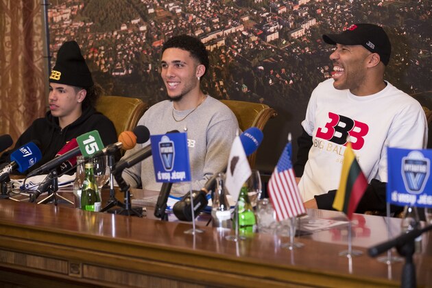 American basketball players LiAngelo Ball, center, and LaMelo Ball, left, and their father LaVar Ball participate in a media conference at the Harmony park hotel in Vaizgaikiemis village, Prienai district, Lithuania, Friday, Jan. 5, 2018.  LiAngelo Ball and LaMelo Ball have both signed a one-year contracts to play for Lithuanian professional basketball club Prienai - Birstonas Vytautas in the southern Lithuania town of Prienai, some 110 km (68 miles) from the Lithuanian capital Vilnius.(AP Photo/Mindaugas Kulbis)