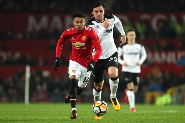 MANCHESTER, ENGLAND - JANUARY 05:  Jesse Lingard of Manchester United competes with George Thorne of Derby County during the Emirates FA Cup Third Round match between Manchester United and Derby County at Old Trafford on January 5, 2018 in Manchester, England.  (Photo by Matthew Ashton - AMA/Getty Images)