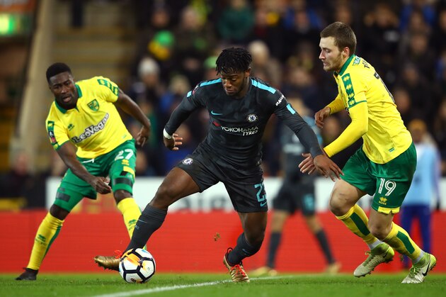 NORWICH, ENGLAND - JANUARY 06:  Michy Batshuayi of Chelsea is closed down by Alexander Tettey (L) and Tom Trybull of Norwich City during The Emirates FA Cup Third Round match between Norwich City and Chelsea at Carrow Road on January 6, 2018 in Norwich, England.  (Photo by Clive Mason/Getty Images)