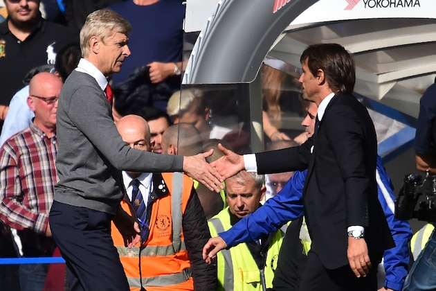Chelsea's Italian head coach Antonio Conte (R) shakes hands with Arsenal's French manager Arsene Wenger (L) after the English Premier League football match between Chelsea and Arsenal at Stamford Bridge in London on September 17, 2017.
The game ended 0-0. / AFP PHOTO / Glyn KIRK / RESTRICTED TO EDITORIAL USE. No use with unauthorized audio, video, data, fixture lists, club/league logos or 'live' services. Online in-match use limited to 75 images, no video emulation. No use in betting, games or single club/league/player publications.  /         (Photo credit should read GLYN KIRK/AFP/Getty Images)