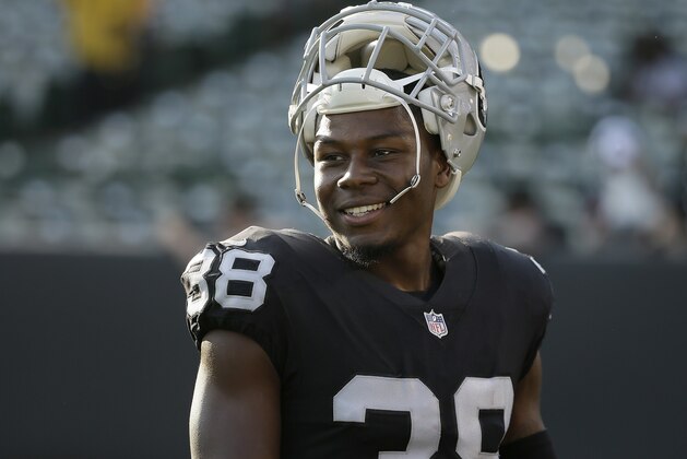 Oakland Raiders strong safety T.J. Carrie (38) smiles before an NFL preseason football game against the Seattle Seahawks in Oakland, Calif., Thursday, Aug. 31, 2017. (AP Photo/Eric Risberg)