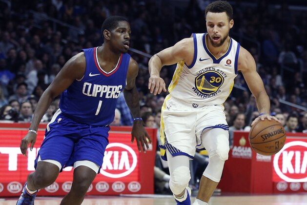 Golden State Warriors guard Stephen Curry, right, dribbles around Los Angeles Clippers guard Jawun Evans during the second half of an NBA basketball game in Los Angeles, Saturday, Jan. 6, 2018. Behind Curry's 45 points, the Warriors won 121-105. (AP Photo/Alex Gallardo)