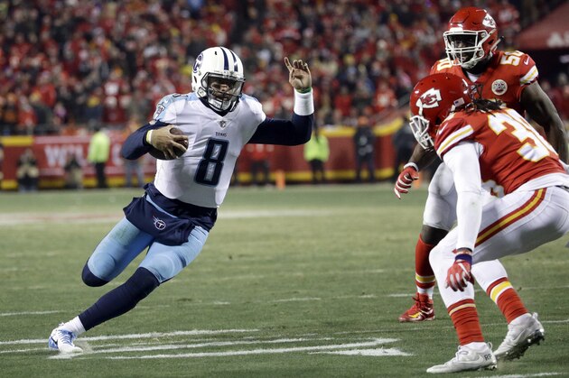 Tennessee Titans quarterback Marcus Mariota (8) carries the ball as Kansas City Chiefs defensive back Ron Parker (38) and linebacker Justin Houston (50) defend during the second half of an NFL wild-card playoff football game in Kansas City, Mo., Saturday, Jan. 6, 2018. (AP Photo/Charlie Riedel)