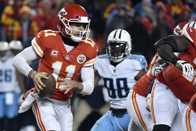 Kansas City Chiefs quarterback Alex Smith (11) carries the ball during the second half of an NFL wild-card playoff football game against the Tennessee Titans, in Kansas City, Mo., Saturday, Jan. 6, 2018. (AP Photo/Ed Zurga)