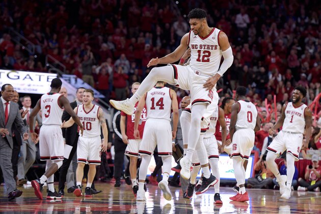 RALEIGH, NC - JANUARY 06: Allerik Freeman #12 of the North Carolina State Wolfpack celebrates with teammates following a play against the Duke Blue Devils at PNC Arena on January 6, 2018 in Raleigh, North Carolina. (Photo by Lance King/Getty Images)