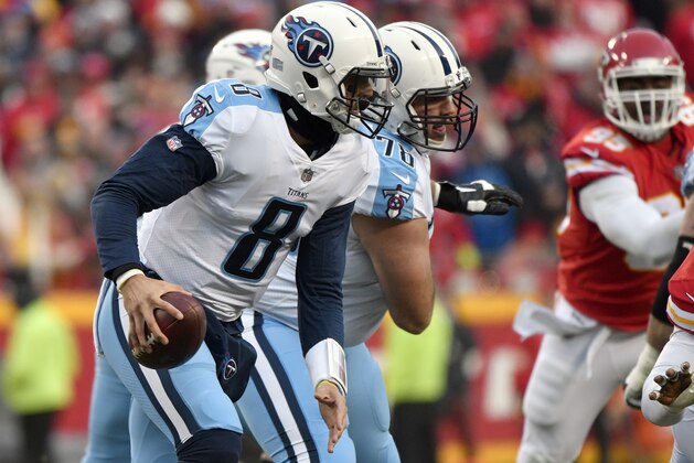 Tennessee Titans quarterback Marcus Mariota (8) carries the ball during the first half of an NFL wild-card playoff football game against Kansas City Chiefs, in Kansas City, Mo., Saturday, Jan. 6, 2018. (AP Photo/Ed Zurga)