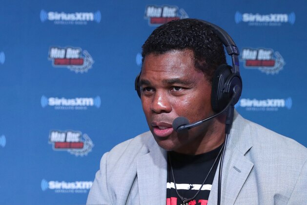 HOUSTON, TX - FEBRUARY 03:  Former NFL player Herschel Walker visits the SiriusXM set at Super Bowl LI Radio Row at the George R. Brown Convention Center on February 3, 2017 in Houston, Texas.  (Photo by Cindy Ord/Getty Images for SiriusXM )