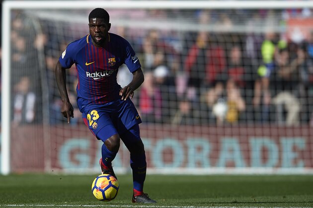 BARCELONA, SPAIN - DECEMBER 02:  Samuel Umtiti of Barcelona runs with the ball during the La Liga match between Barcelona and Celta de Vigo at Camp Nou on December 2, 2017 in Barcelona, Spain.  (Photo by Manuel Queimadelos Alonso/Getty Images)