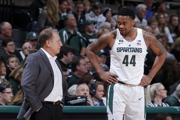 Michigan State coach Tom Izzo, left, and Nick Ward (44) talk during the second half of an NCAA college basketball game against Cleveland State, Friday, Dec. 29, 2017, in East Lansing, Mich. Michigan State won 111-61. (AP Photo/Al Goldis)