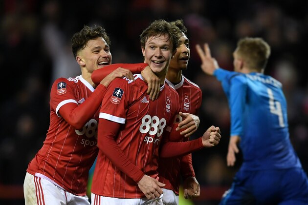 NOTTINGHAM, ENGLAND - JANUARY 07: Kieran Dowell of Nottingham Forest celebrates scoring his team's fourth goal from the penalty spot as Per Mertesacker of Arsenal suggests he kicked the ball twice taking the penalty during The Emirates FA Cup Third Round match between Nottingham Forest and Arsenal at City Ground on January 7, 2018 in Nottingham, England. (Photo by Laurence Griffiths/Getty Images) NOTTINGHAM, ENGLAND - JANUARY 07: Kieran Dowell of Nottingham Forest celebrates scoring his team's fourth goal from the penalty spot as Per Mertesacker of Arsenal suggests he kicked the ball twice taking the penalty during The Emirates FA Cup Third Round match between Nottingham Forest and Arsenal at City Ground on January 7, 2018 in Nottingham, England. (Photo by Laurence Griffiths/Getty Images)