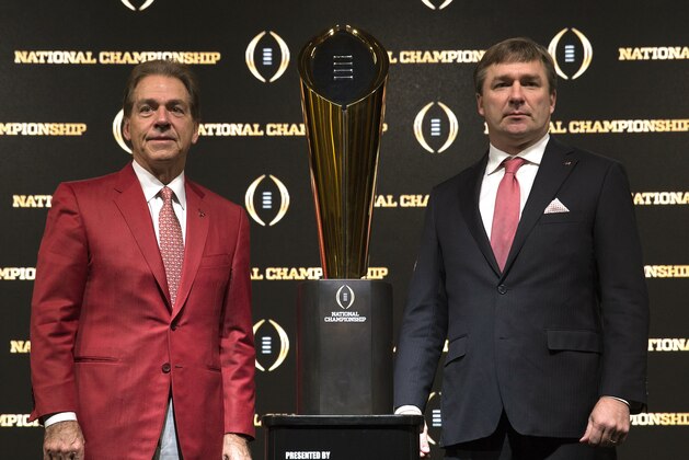 ATLANTA, GA - JANUARY 07: University of Alabama head coach Nick Saban (left) and University of Georgia head coach Kirby Smart stand with the College Football Playoff National Championship trophy after a Coaches Press Conference on January 7, 2018 in Atlanta, Georgia. (Photo by Mike Zarrilli/Getty Images) ATLANTA, GA - JANUARY 07: University of Alabama head coach Nick Saban (left) and University of Georgia head coach Kirby Smart stand with the College Football Playoff National Championship trophy after a Coaches Press Conference on January 7, 2018 in Atlanta, Georgia. (Photo by Mike Zarrilli/Getty Images)