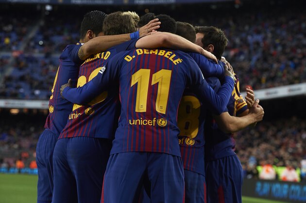 BARCELONA, SPAIN - JANUARY 07:  Lionel Messi of Barcelona celebrates scoring his team's first goal with his teammates during the La Liga match between Barcelona and Levante at Camp Nou on January 7, 2018 in Barcelona, Spain.  (Photo by Manuel Queimadelos Alonso/Getty Images)